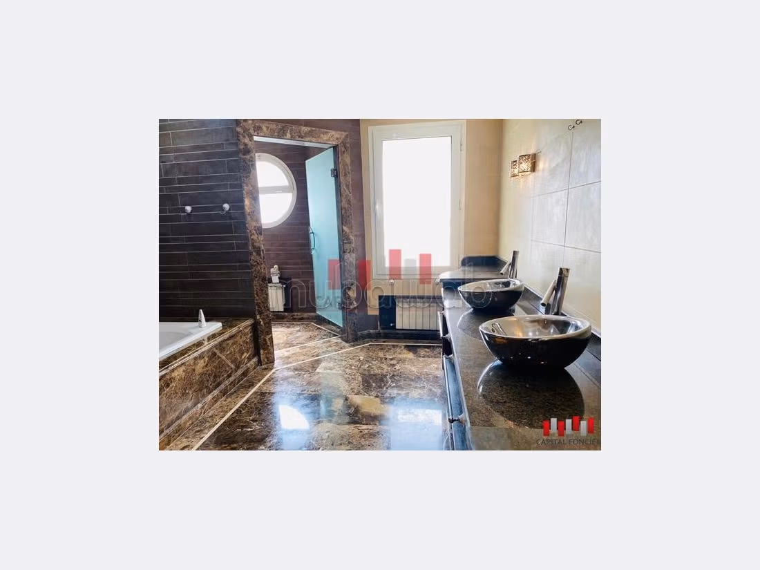 High quality villa rental in Ain Diab. Small area 1400 m². Air-conditioned. 