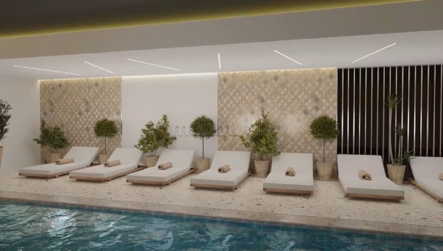 Vendita di un bell'appartamento a Guéliz. Superficie di 62 m². Salotto tipico marocchino, sistema di sicurezza.