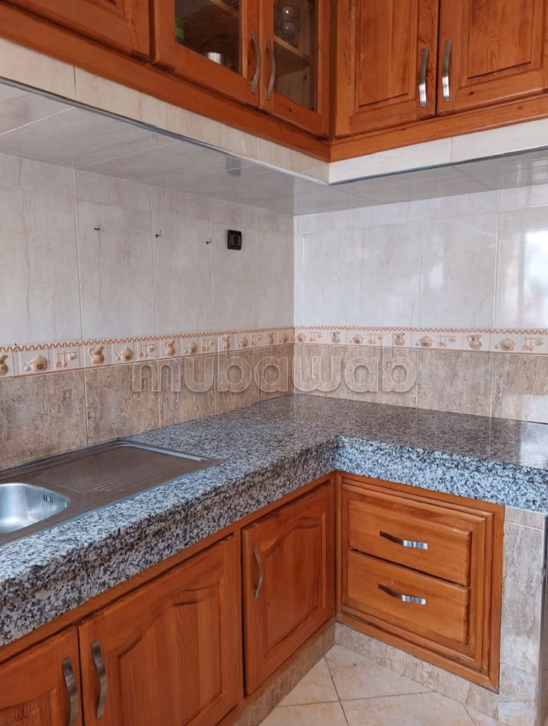 Find an apartment to buy in Maghrib Arabi. 3 large rooms. Traditional Moroccan living room. 