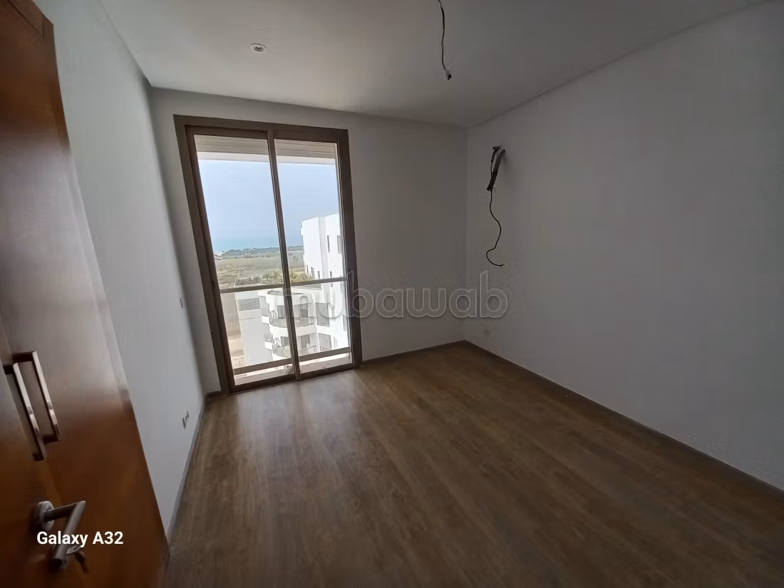 Location appartement 2 chambres, NEUF, AVEC VUE MER, à 7 minutes du morocco mall dans une résidence securisée. Jardin, piscine