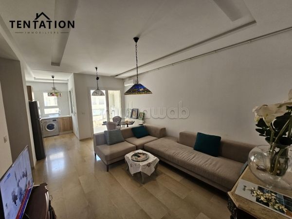 Sale of a lovely apartment in Cité El Wafa. Dimension 90 m². Parking spaces and terrace