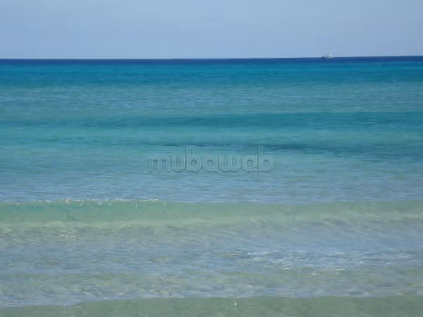 Terrain avec façade sur mer