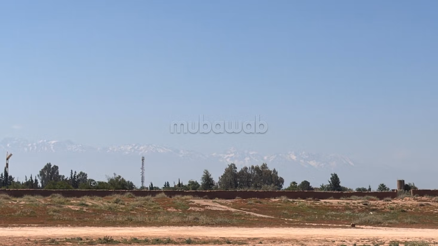 Terrain 2 hectares, paved road, 15 km