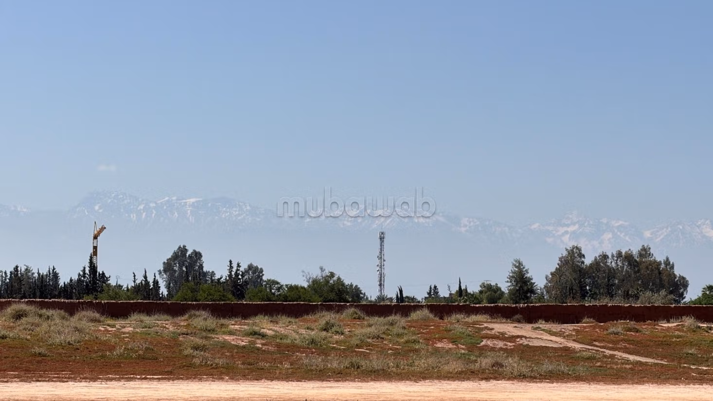 Terrain 2 hectares, paved road, 15 km