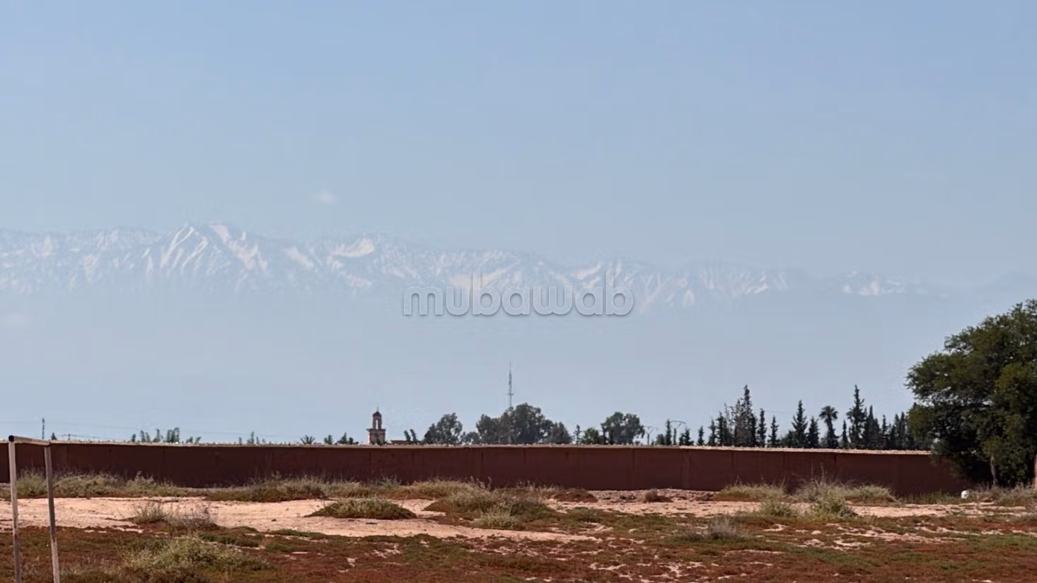 Terrain 2 hectares, paved road, 15 km