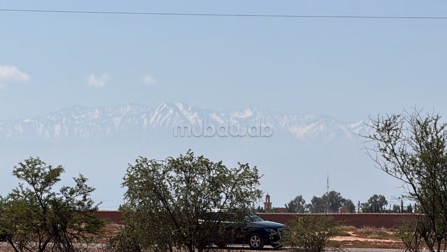 Terrain 2 hectares, paved road, 15 km
