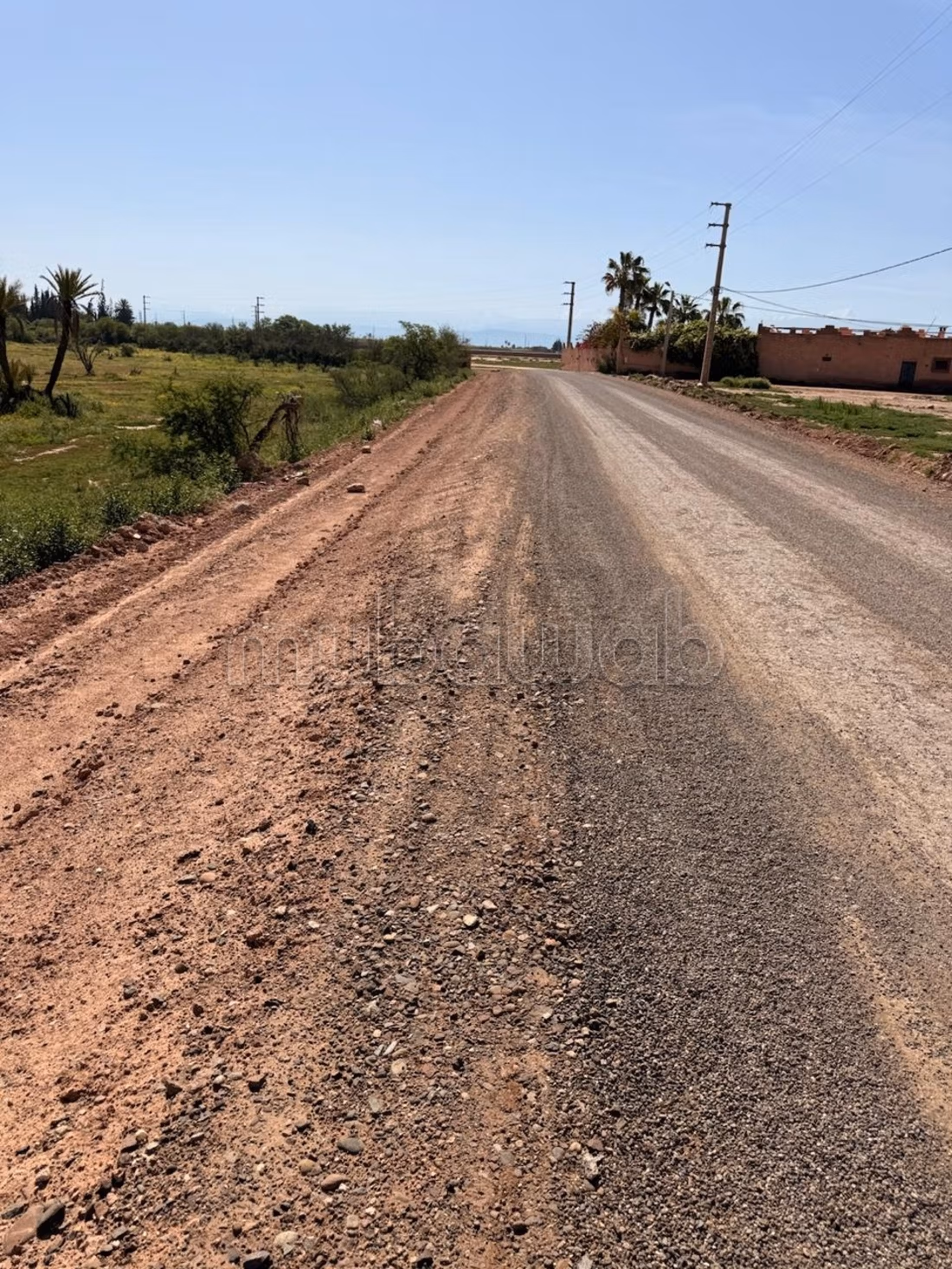 Terrain 2 hectares, paved road, 15 km