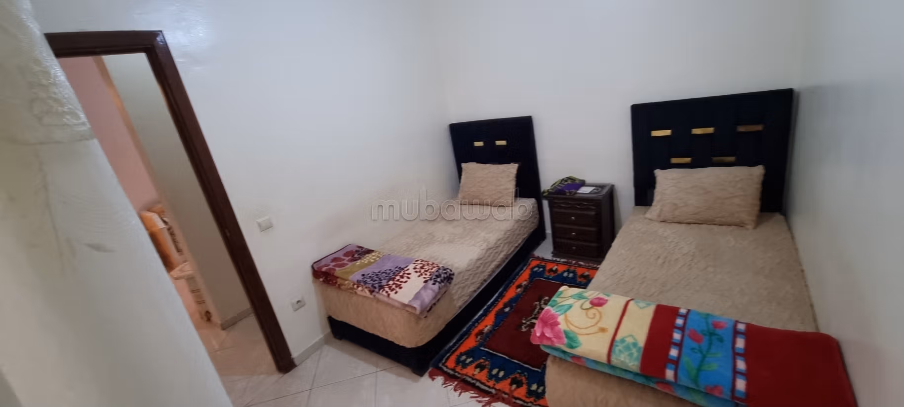 Trouvez un appartement à acheter dans le Hivernage. Petite superficie 65 m². Salon avec décoration marocaine, système de satellite général. — 5