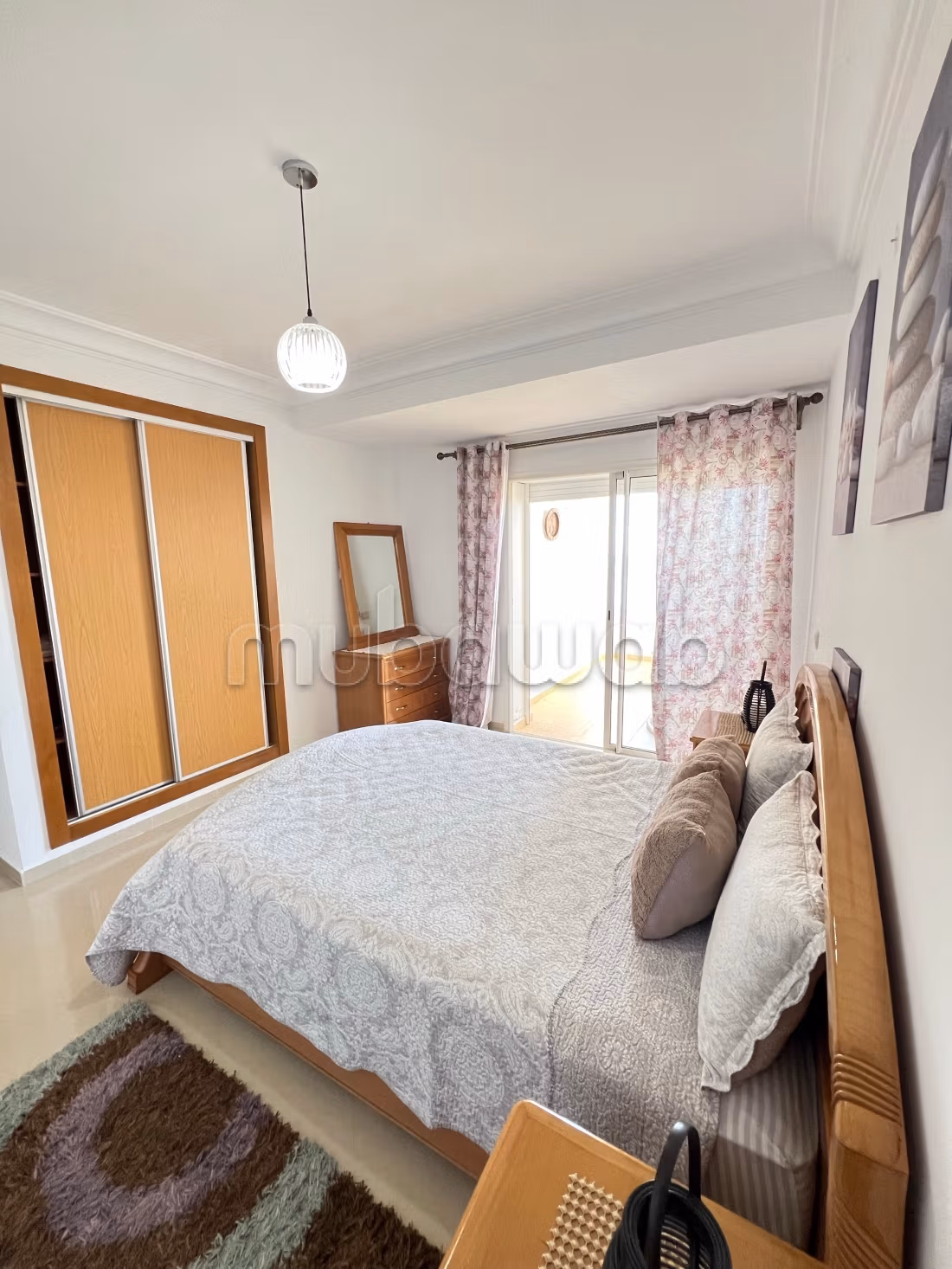 Apartment location in Asilah. 2 pleasant bedrooms. With elevator and green space