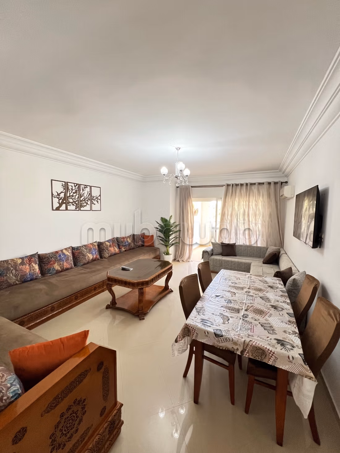 Apartment location in Asilah. 2 pleasant bedrooms. With elevator and green space