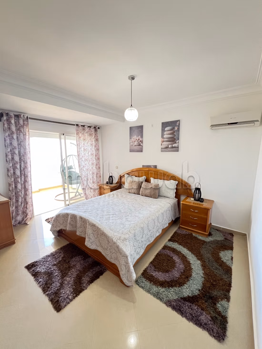 Apartment location in Asilah. 2 pleasant bedrooms. With elevator and green space