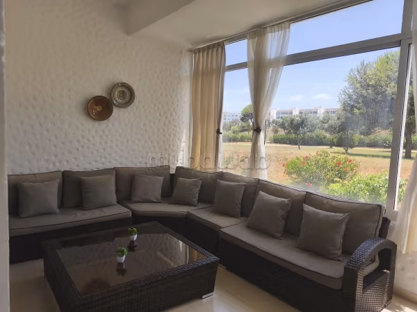 Appartements à louer à Asilah. Surface totale 68 m². Salon typique marocain, résidence sécurisée