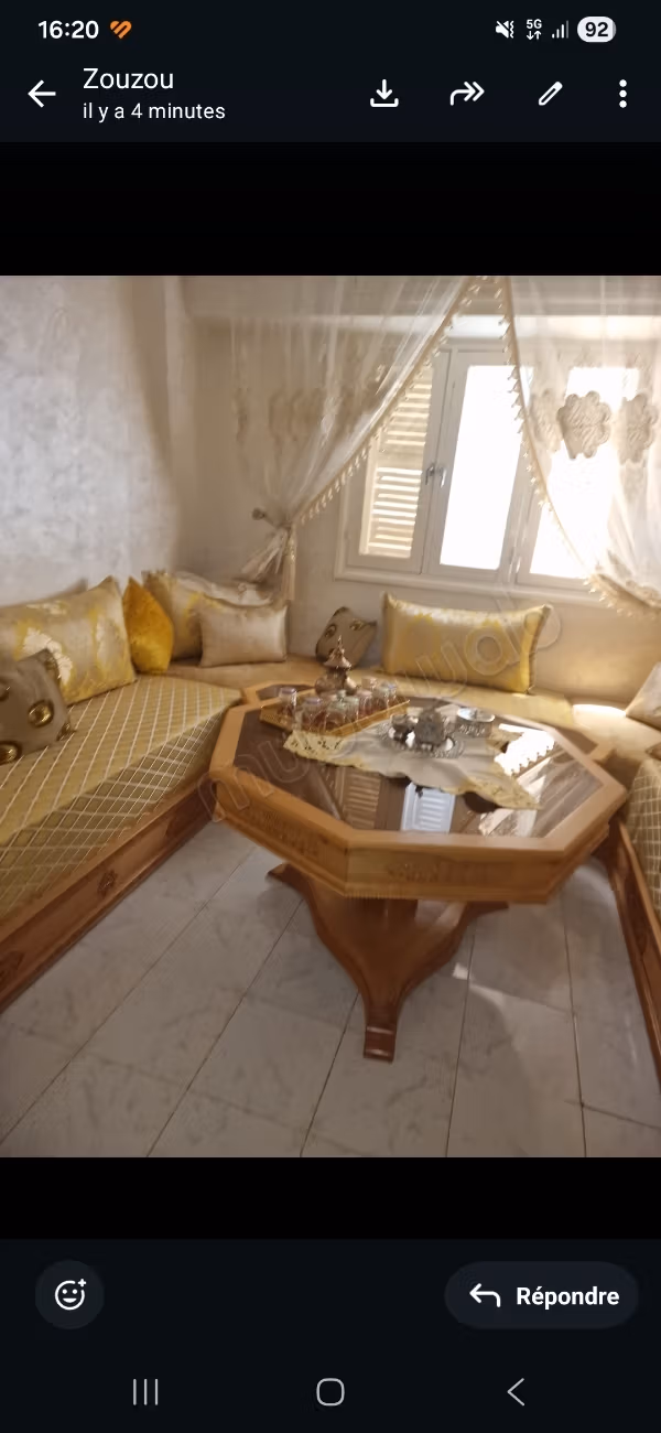 Apartment for sale in Ain Mezouar. Total area 56 m². Moroccan living room and satellite dish.