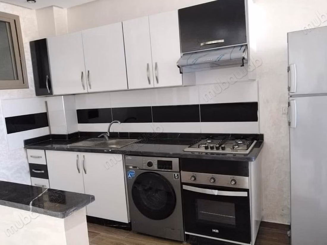 Appartement Dahomey City strand en gezellige Marjane