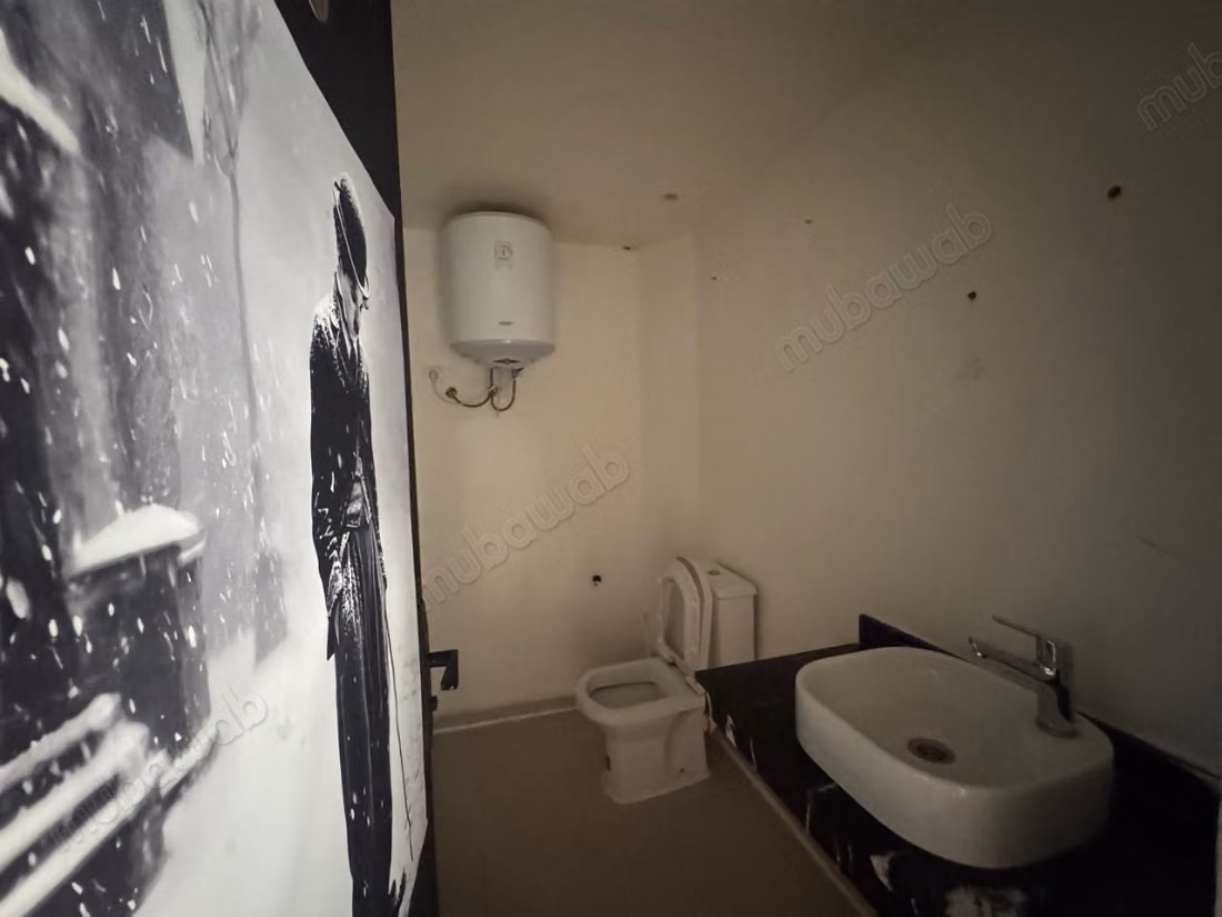 Grande salle à louer dans un immeuble au centre de Guéliz