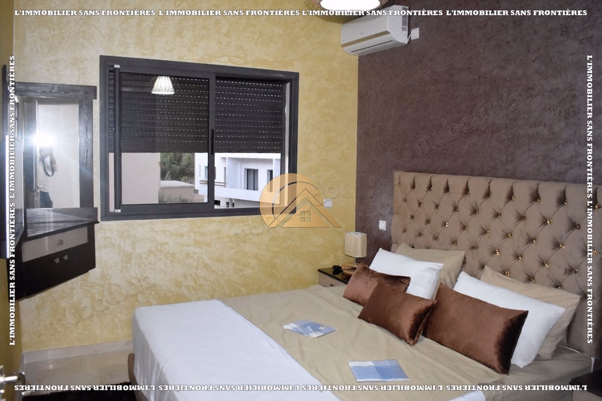 Appartement de 85 m² à louer à Targa – 2 chambres, double salon, terrasse, piscine et jardin collectif