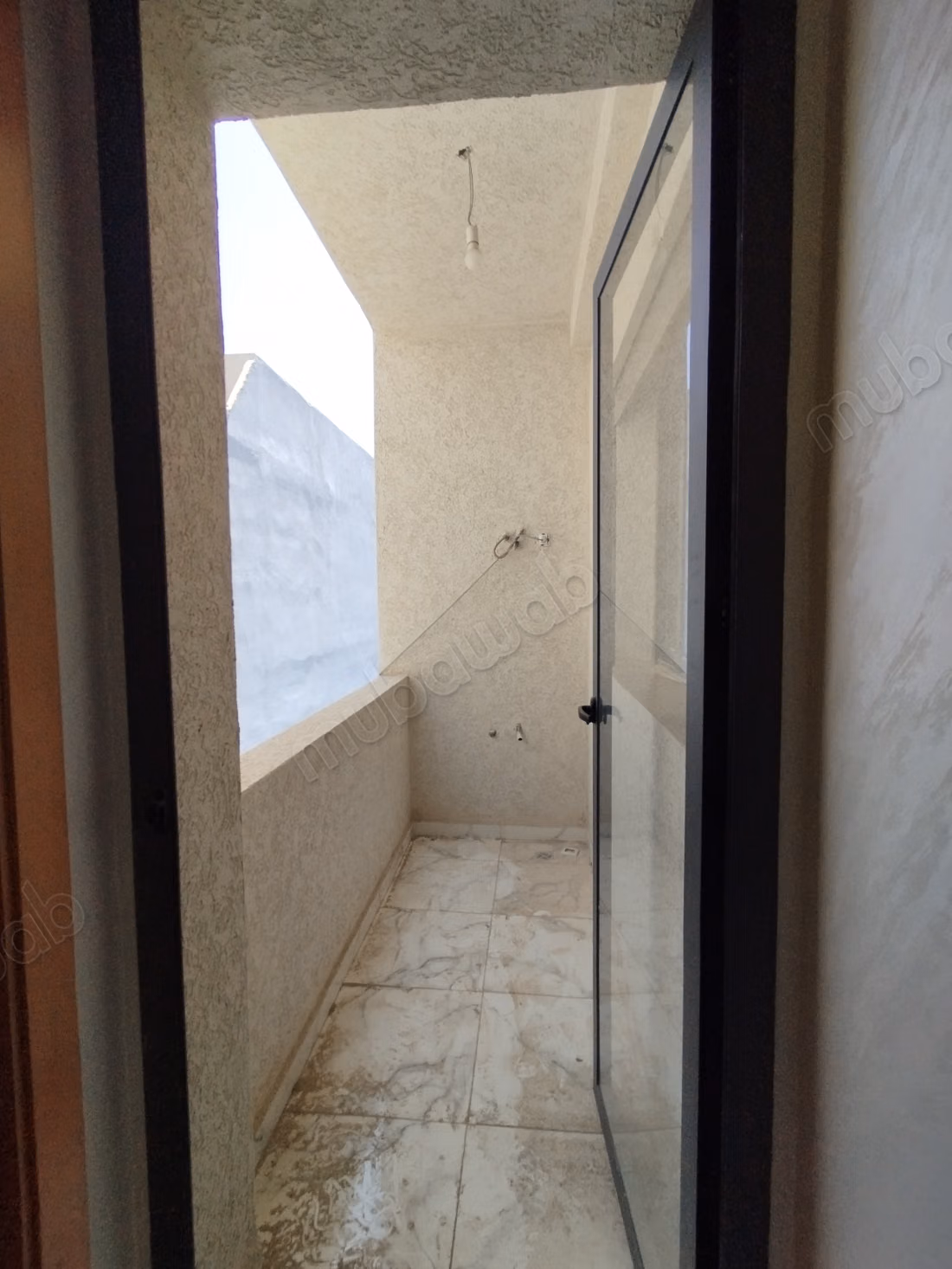 Beautiful apartment for sale in Martil. Total area 62 m². Strong door, traditional Moroccan lounge.