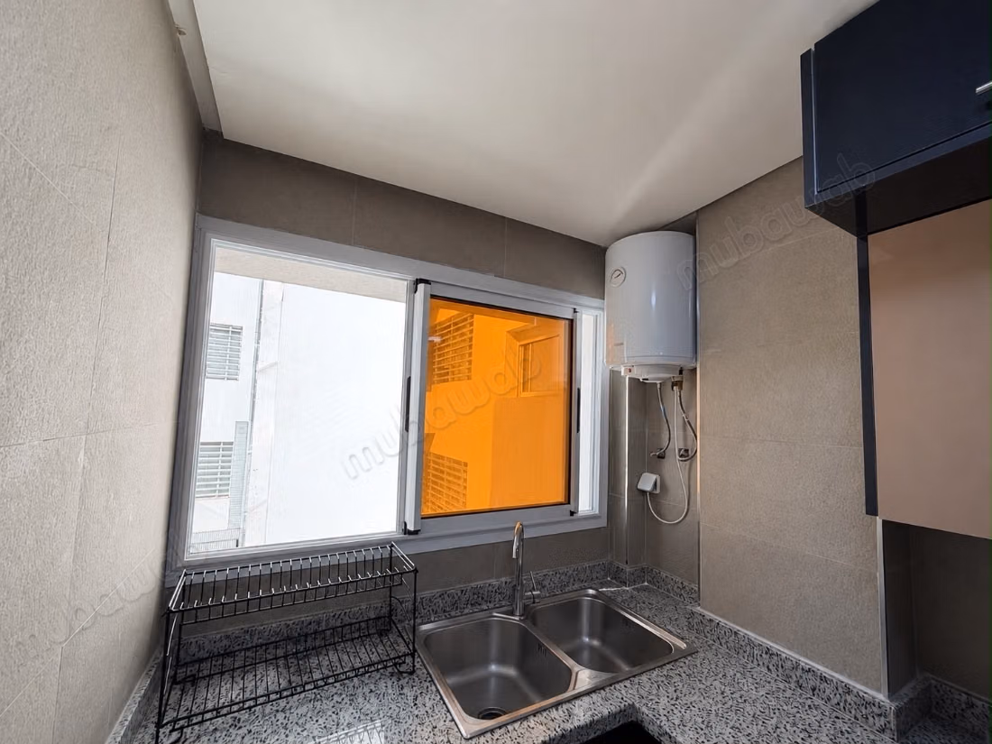 New apartment, never lived in, located on the third floor of a modern residence (less than five years old) with an elevator. The building is situated directly on a main thoroughfare in the heart of Rabat, offering a strategic location that facilitates access to various neighborhoods and services.