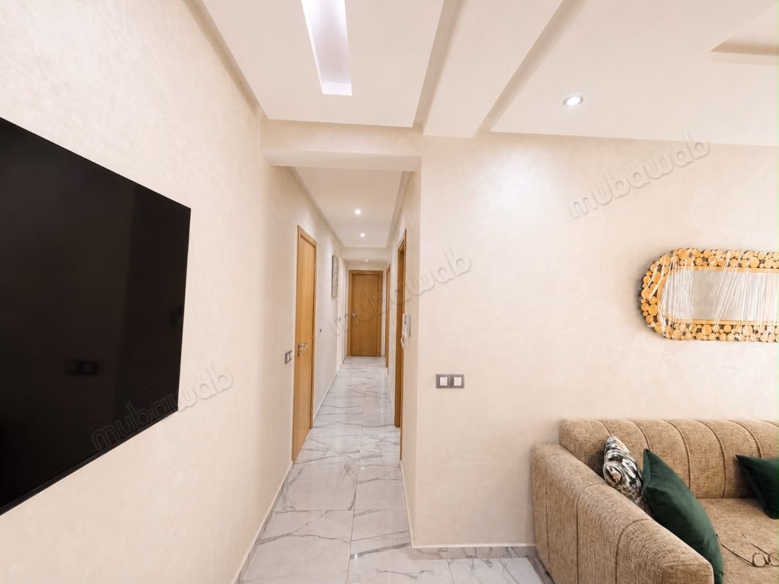 New apartment, never lived in, located on the third floor of a modern residence (less than five years old) with an elevator. The building is situated directly on a main thoroughfare in the heart of Rabat, offering a strategic location that facilitates access to various neighborhoods and services.