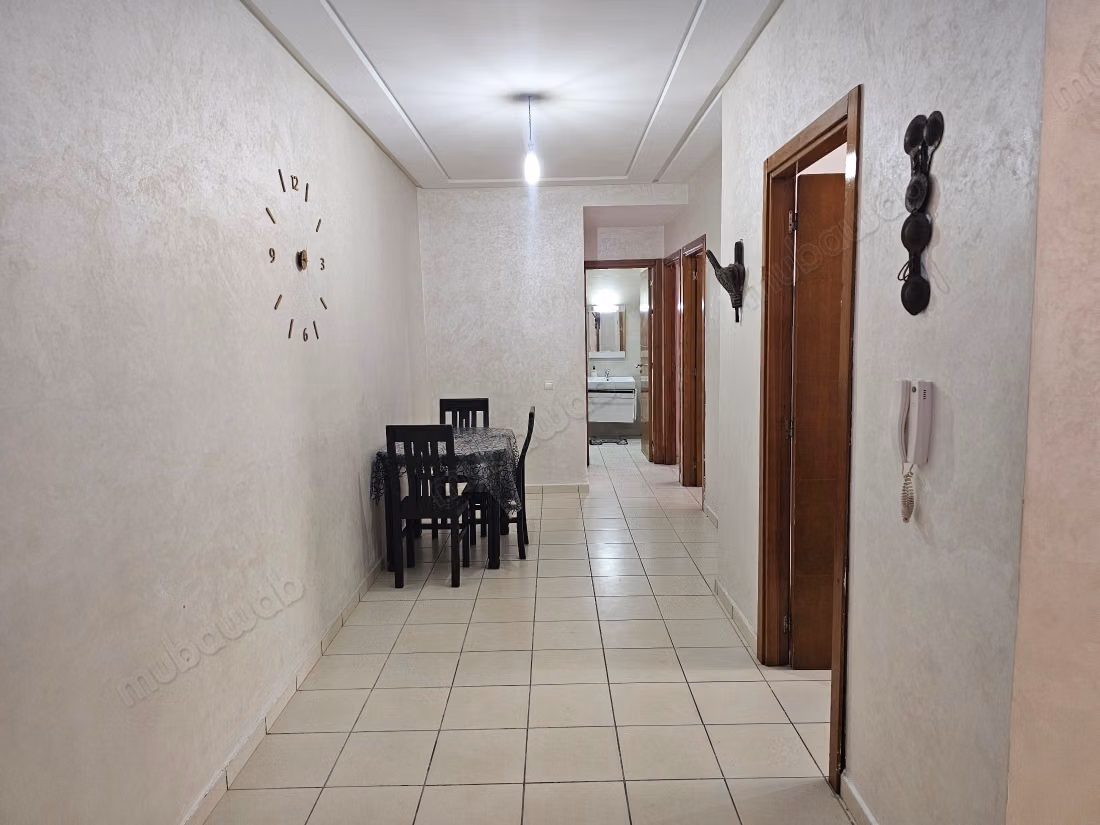 Rent this apartment in Mimosas. 2 bedrooms. Traditional Moroccan living room, secure residence
