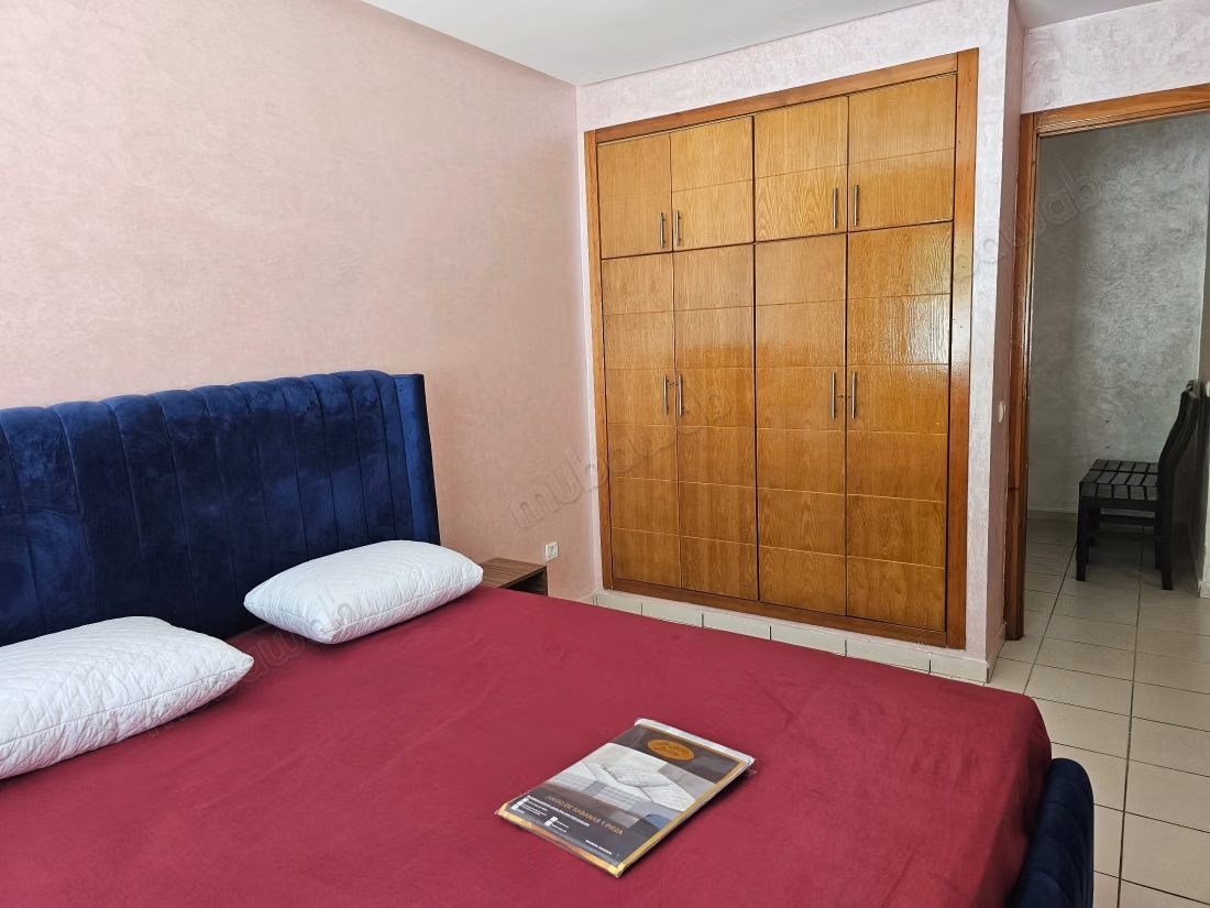 Rent this apartment in Mimosas. 2 bedrooms. Traditional Moroccan living room, secure residence