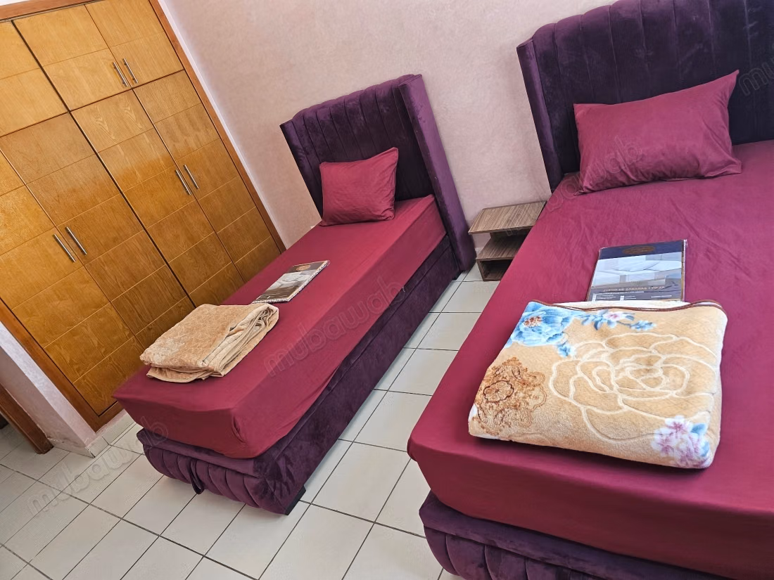 Rent this apartment in Mimosas. 2 bedrooms. Traditional Moroccan living room, secure residence