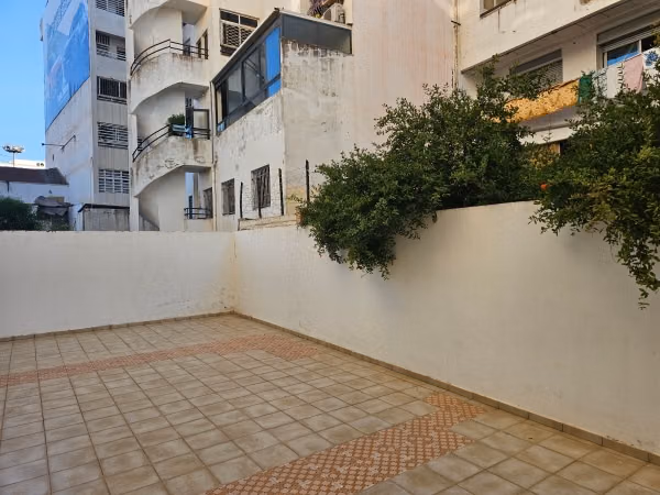 Rent this apartment in Mimosas. 2 bedrooms. Traditional Moroccan living room, secure residence