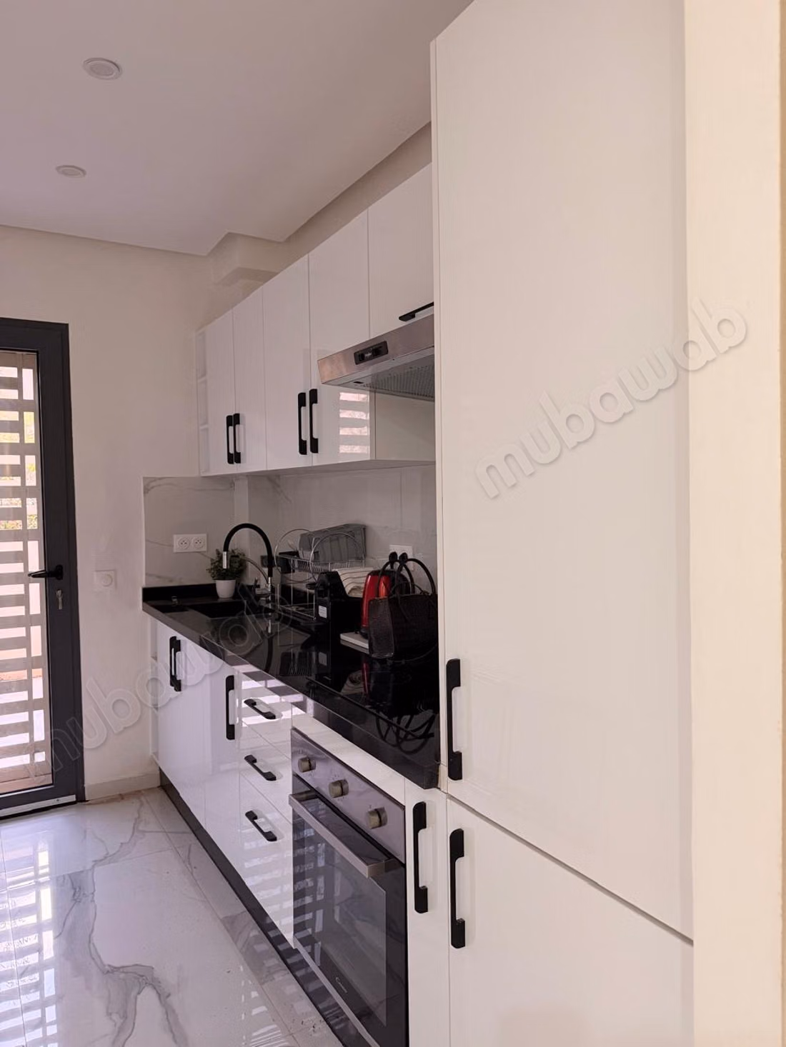 Appartement 2 chambres et salonen rez de jardin dans résidence vu atlas