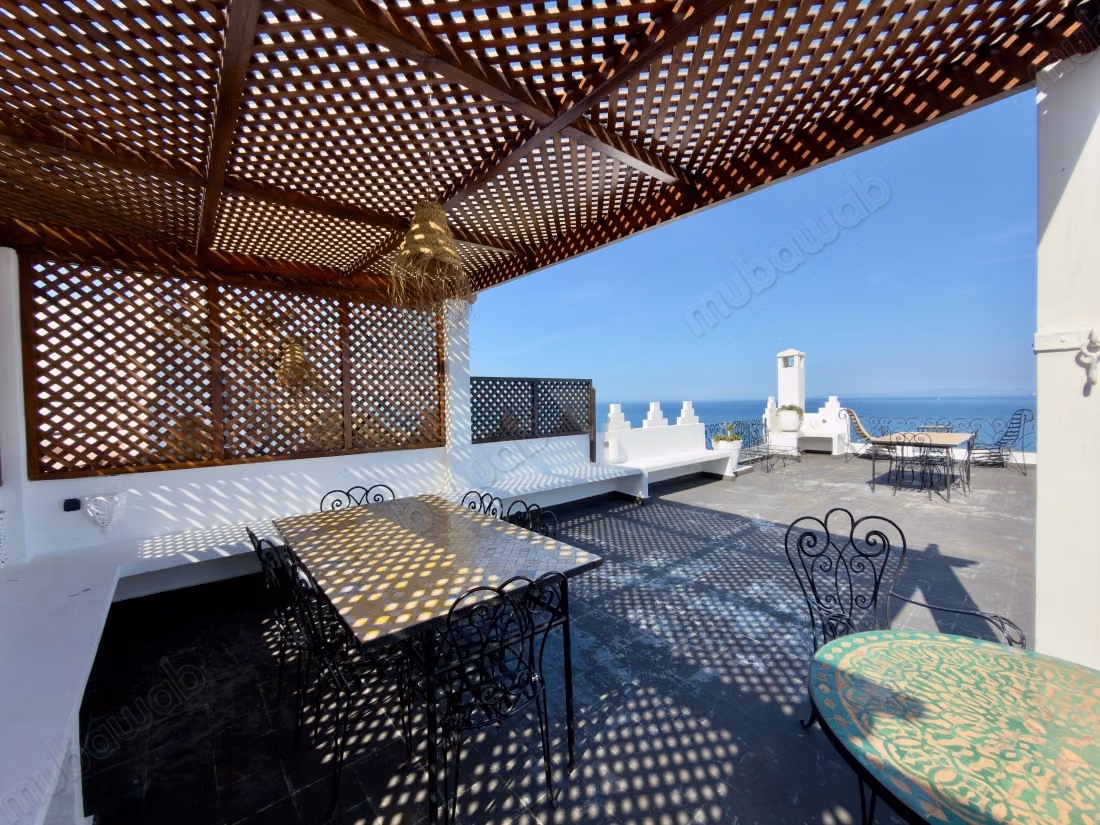 Maison traditionnelle avec vue sur la mer